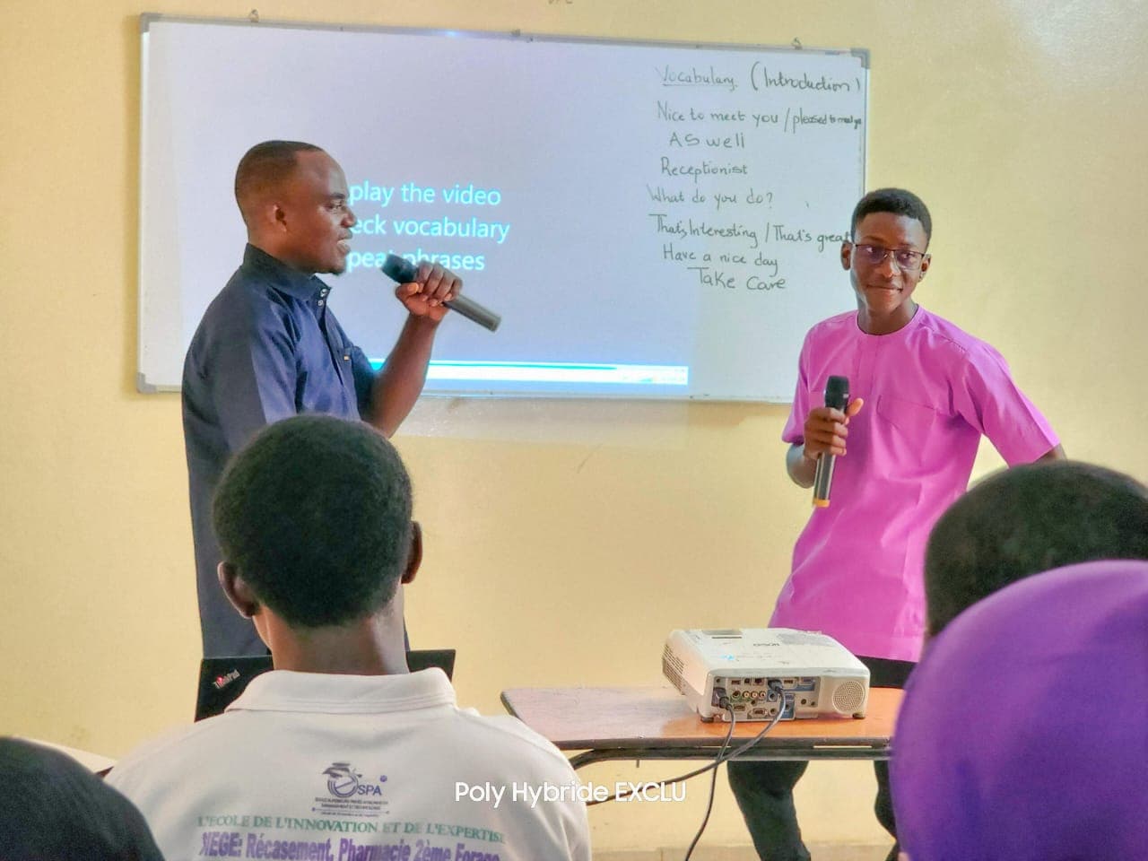 English instructors teaching vocabulary at a whiteboard in a D.A Language Academy classroom in Niamey